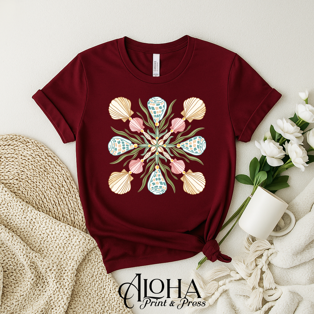 Maroon Hawaiian Hebrew cone shell mandala shirt featuring quilt-inspired ocean shell graphic
