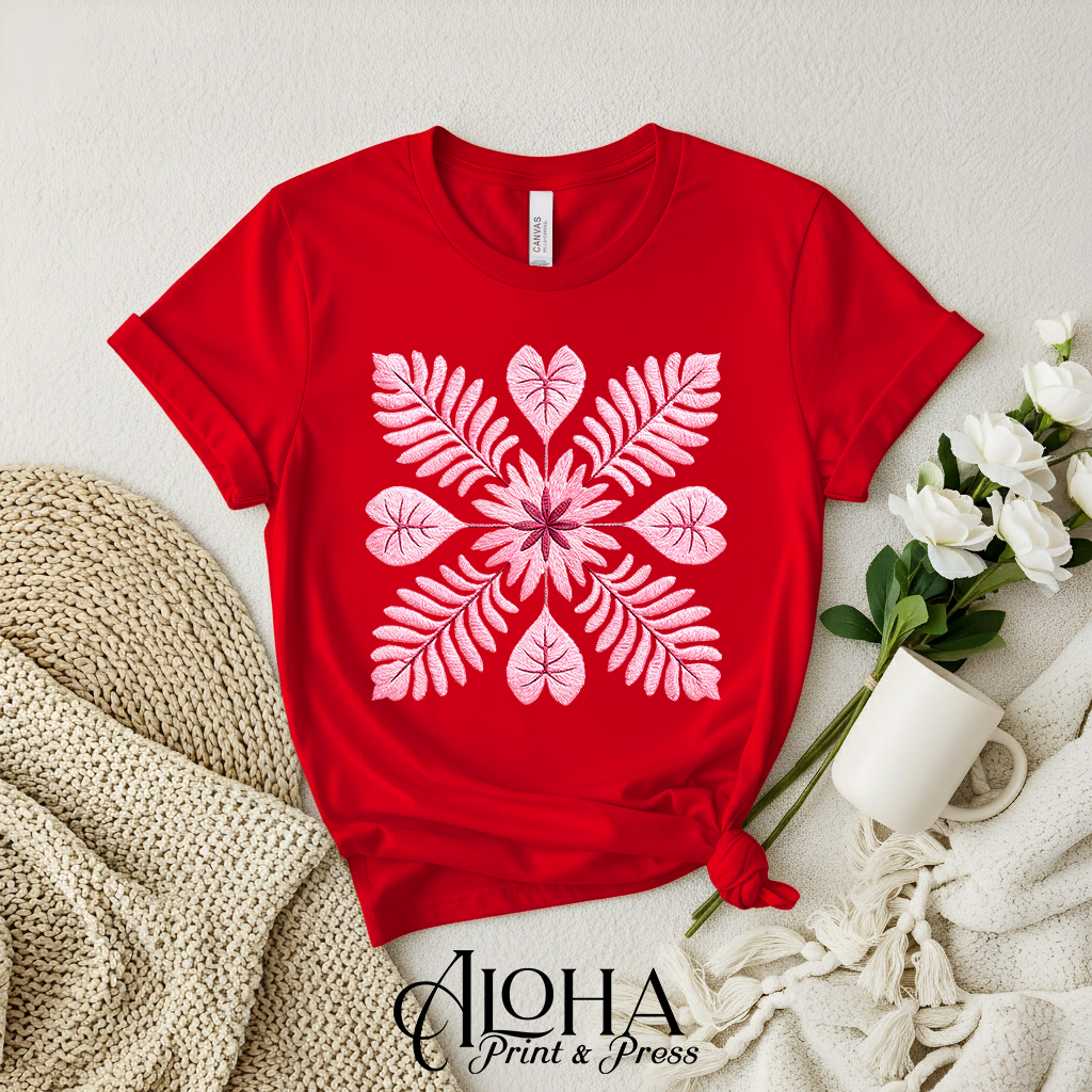 Blush pink Hawaiian quilt botanical design on red shirt – island floral mandala tee