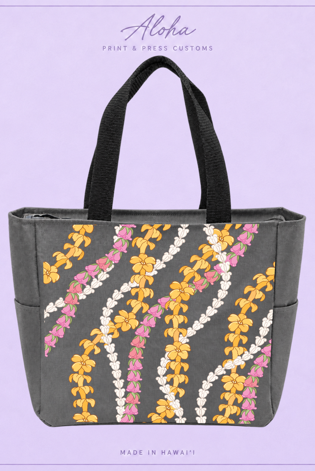 Dark charcoal tote bag with Puakenikeni, Lokelani, and Crownflower lei print