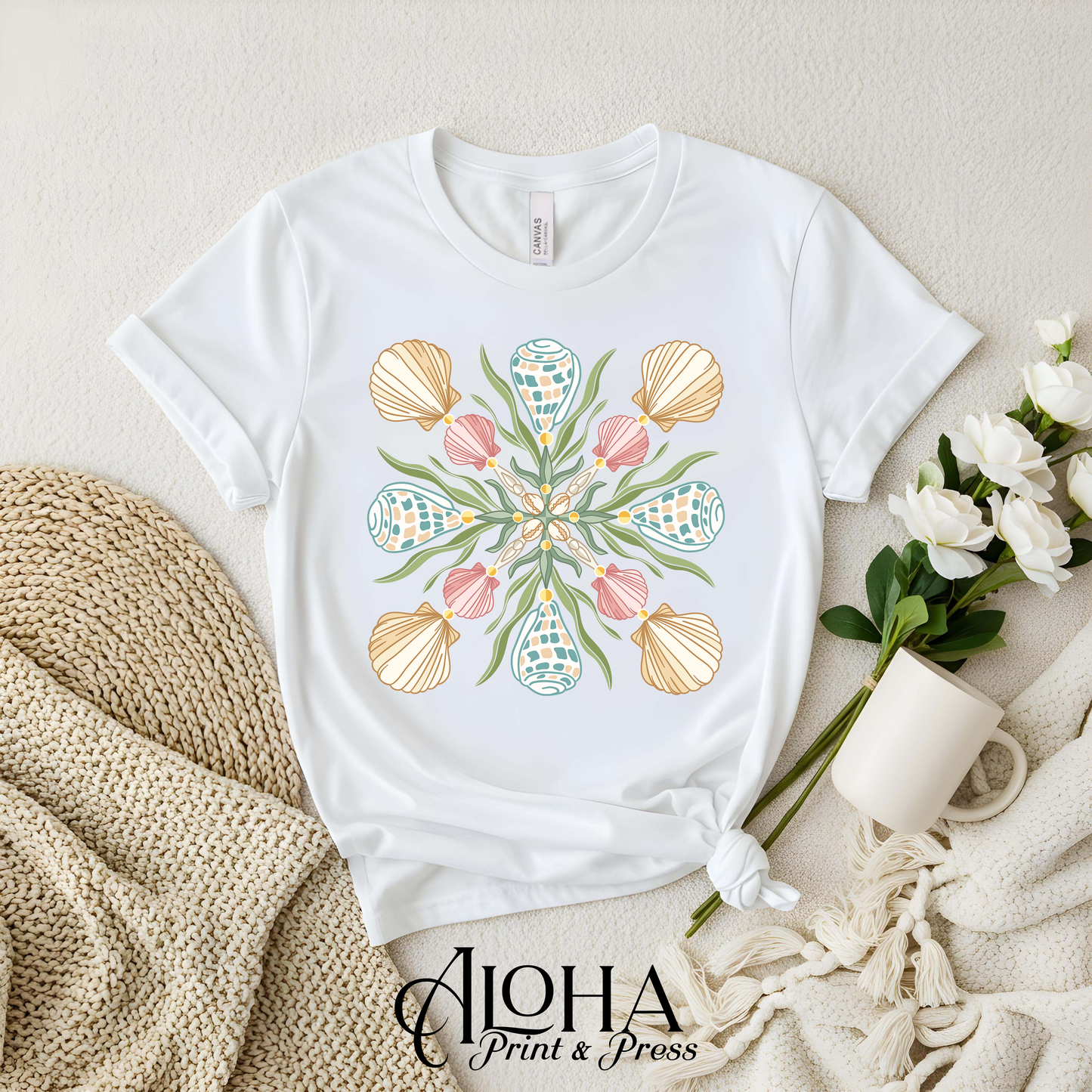 White Hawaiian cone shell quilt style graphic tee with coastal mandala seashell artwork