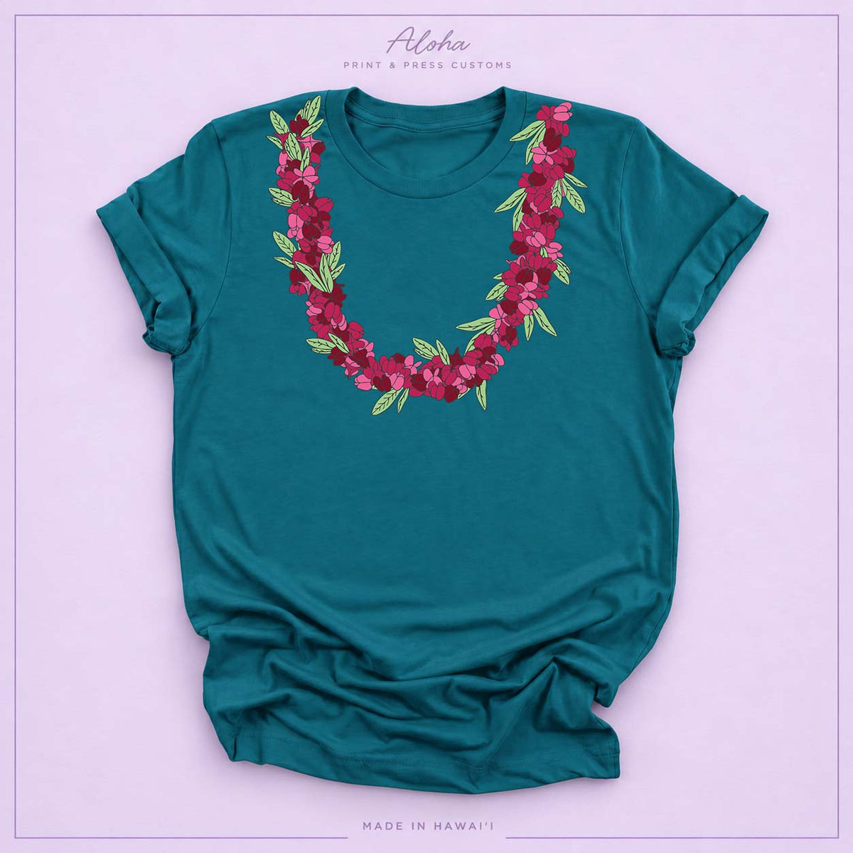 Deep teal T-shirt featuring an ʻAʻaliʻi flower lei design