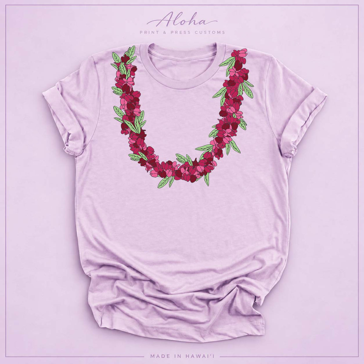 Lilac T-shirt featuring an ʻAʻaliʻi flower lei design