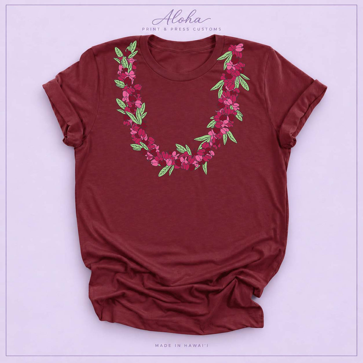 Maroon T-shirt featuring an ʻAʻaliʻi flower lei design