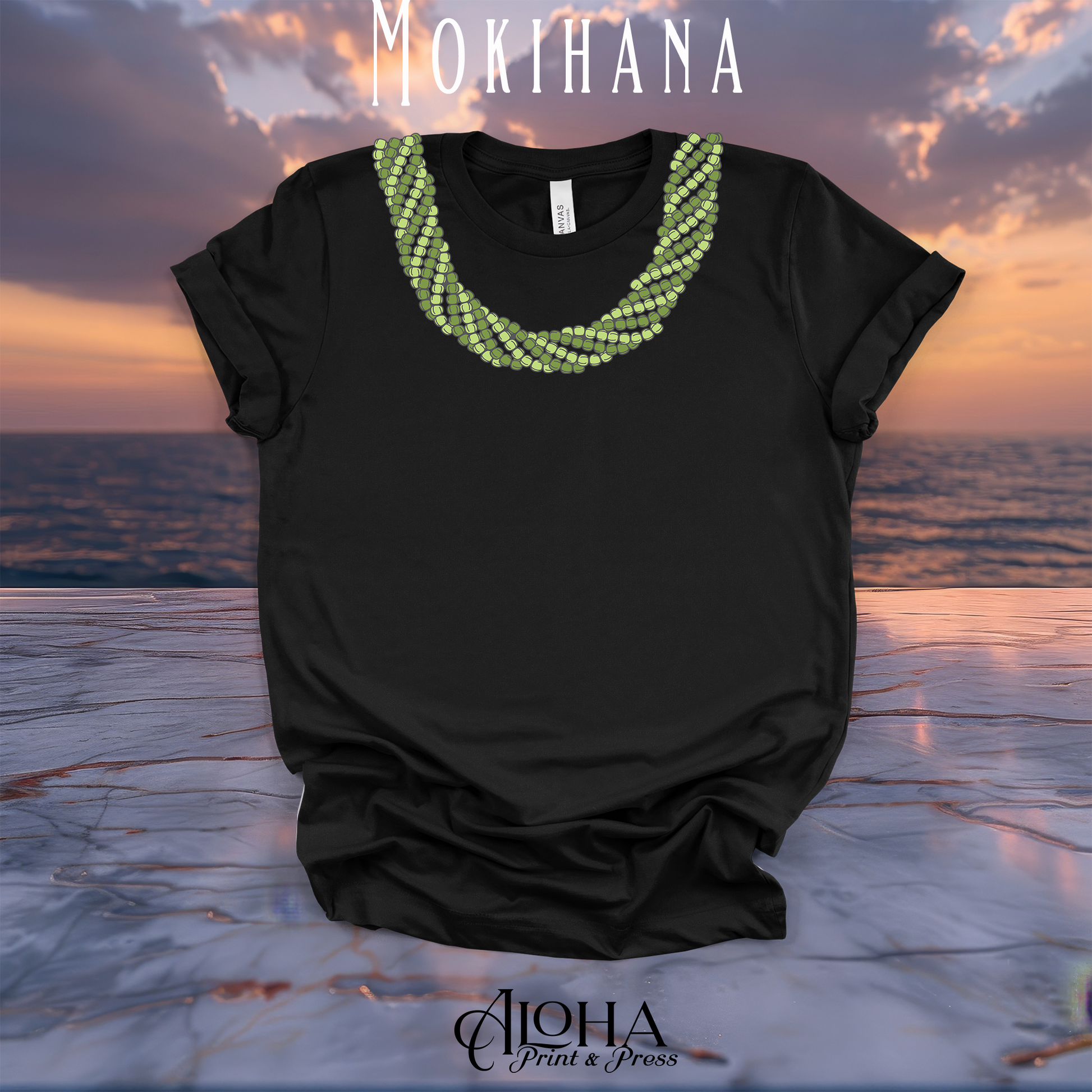 Black Mokihana lei graphic T-shirt with a layered green Hawaiian lei neckline design against a sunset ocean background