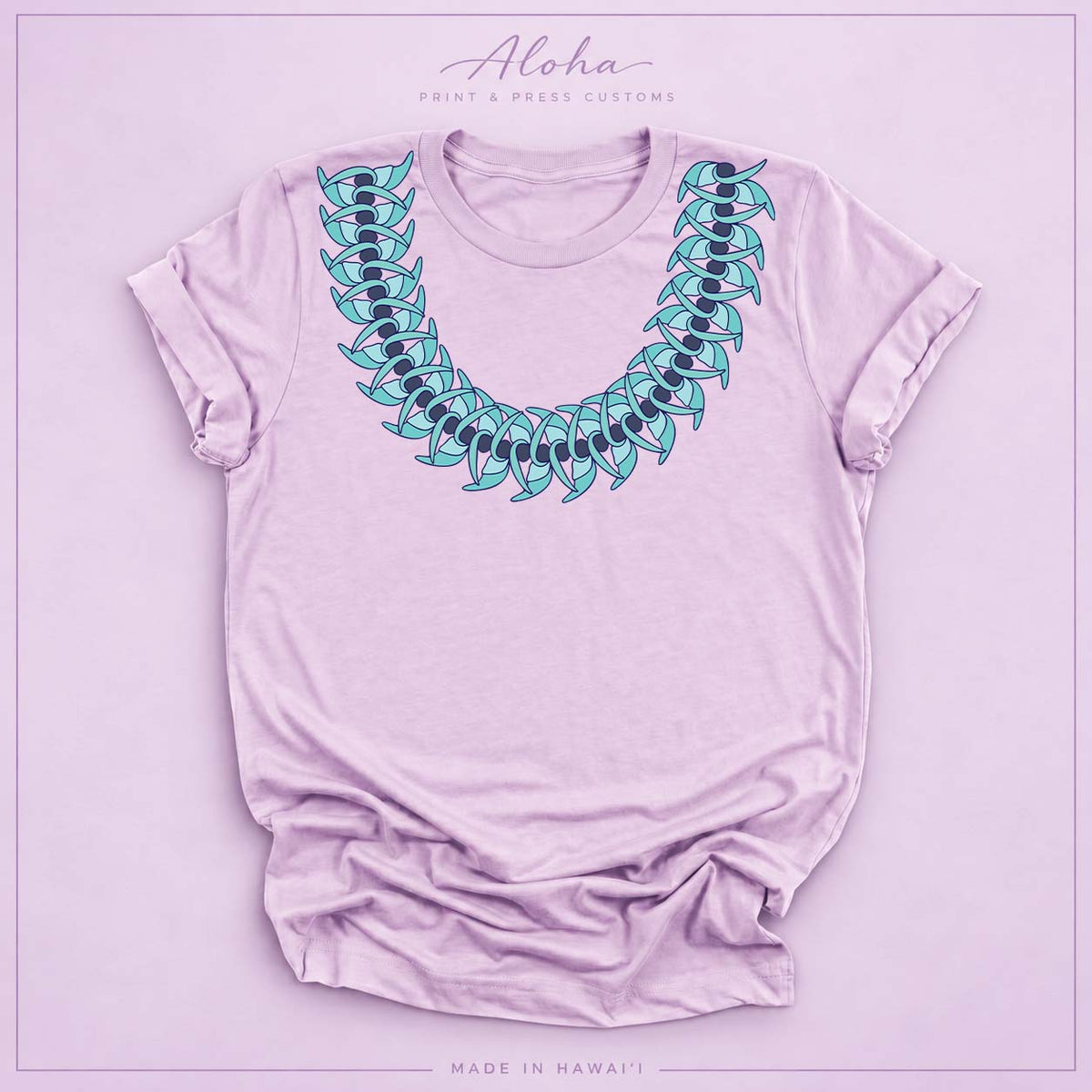 Lilac T-shirt featuring a Blue Jade Hawaiian leaf lei design