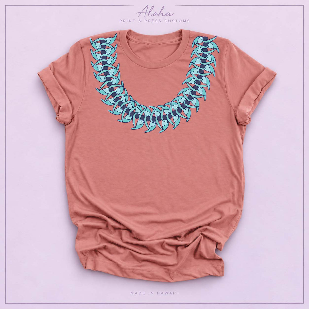 Mauve T-shirt featuring a Blue Jade Hawaiian leaf lei design