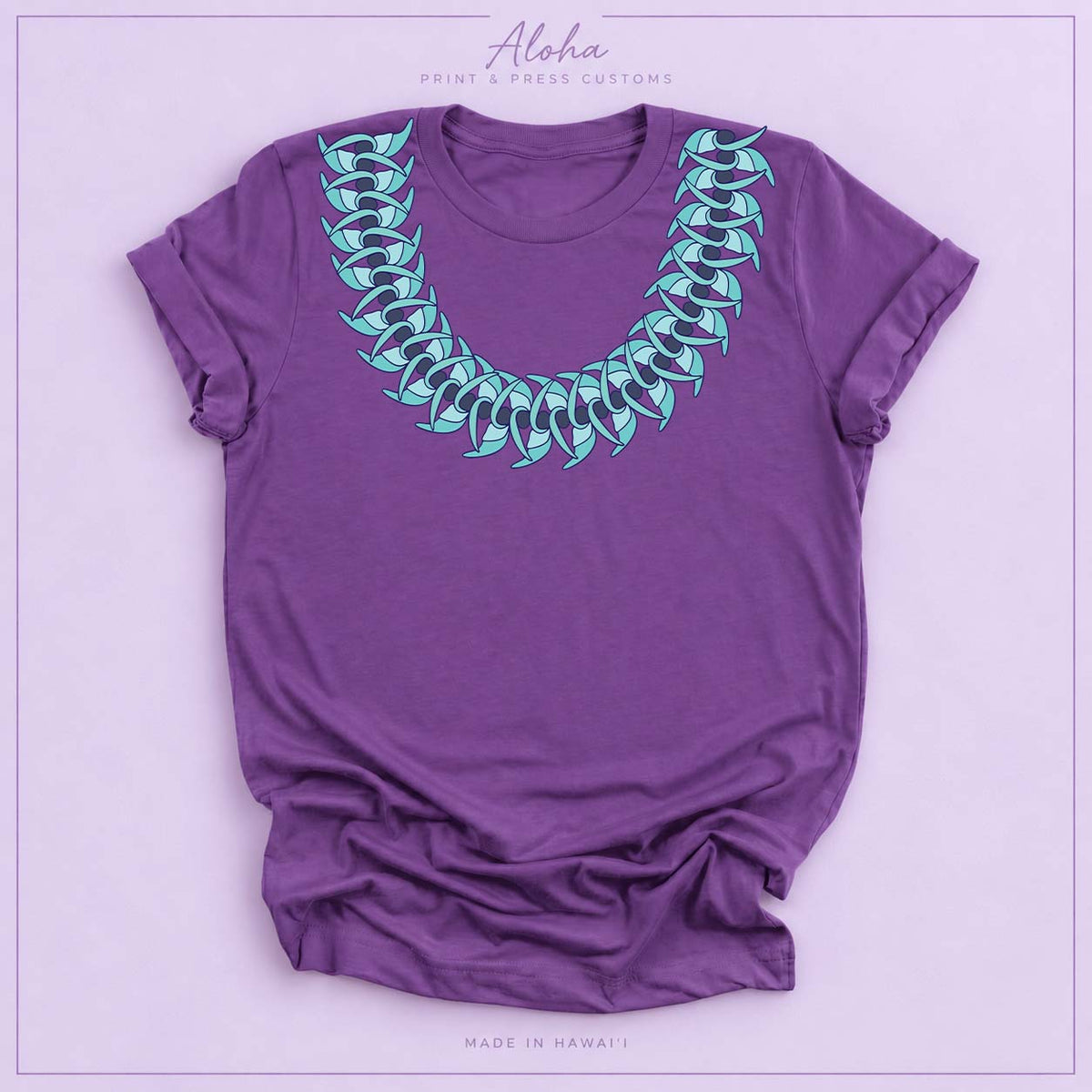 Royal purple T-shirt featuring a Blue Jade Hawaiian leaf lei design