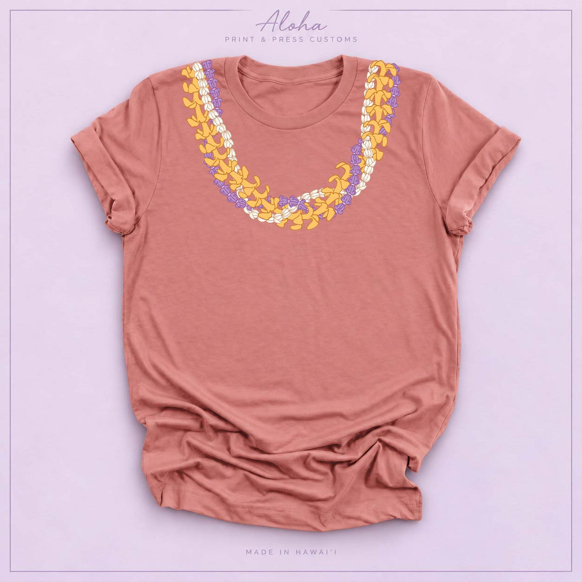 Mauve T-shirt with Crownflower, Pikake and Puakenikeni Hawaiian lei necklace design on Aloha Print & Press Customs branded background