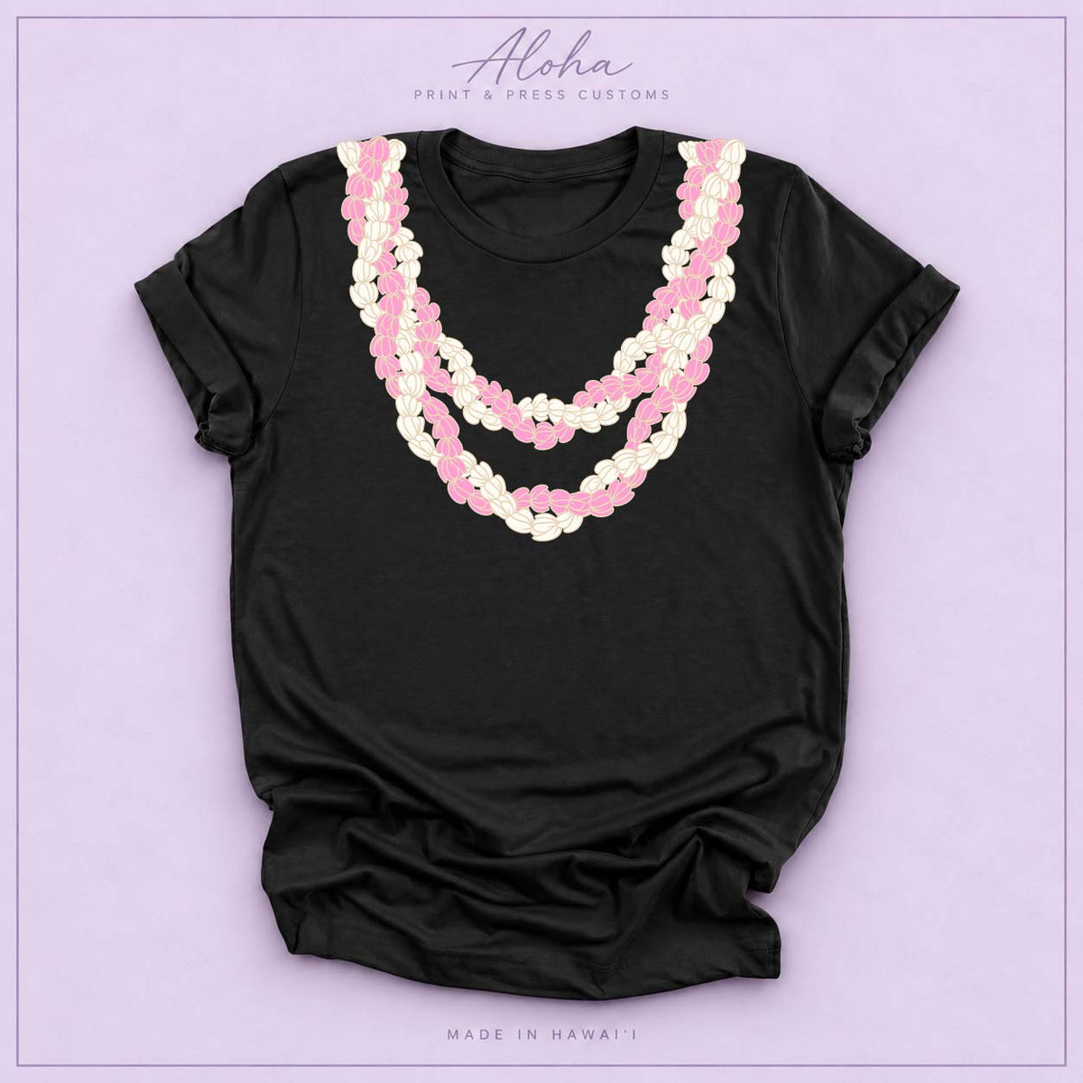 Black T-shirt with pink and cream Double Pikake Lei design on Aloha Print & Press Customs branded background