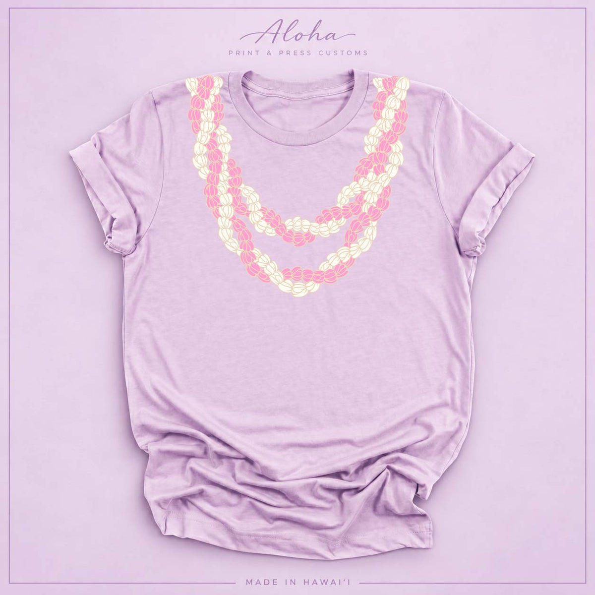 Lilac T-shirt with pink and cream Double Pikake Lei design on Aloha Print & Press Customs branded background