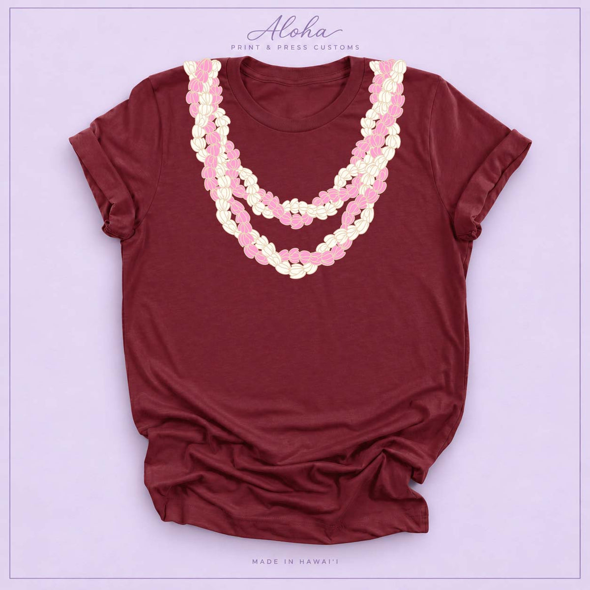 Maroon T-shirt with pink and cream Double Pikake Lei design on Aloha Print & Press Customs branded background