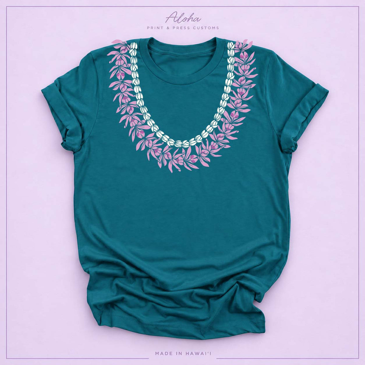 Deep teal T-shirt with Honohono and Pikake Hawaiian lei design on Aloha Print & Press Customs branded background