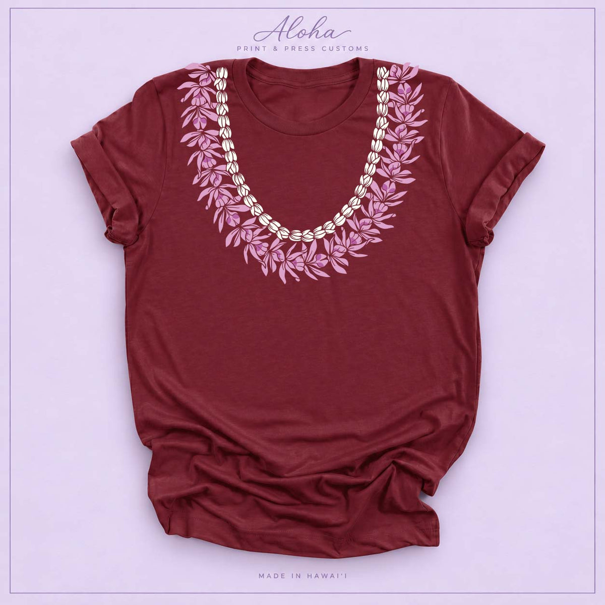 Maroon T-shirt with Honohono and Pikake Hawaiian lei design on Aloha Print & Press Customs branded background