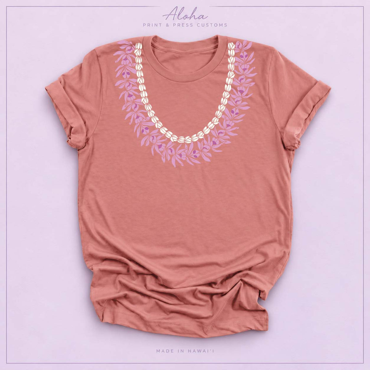 Mauve T-shirt with Honohono and Pikake Hawaiian lei design on Aloha Print & Press Customs branded background