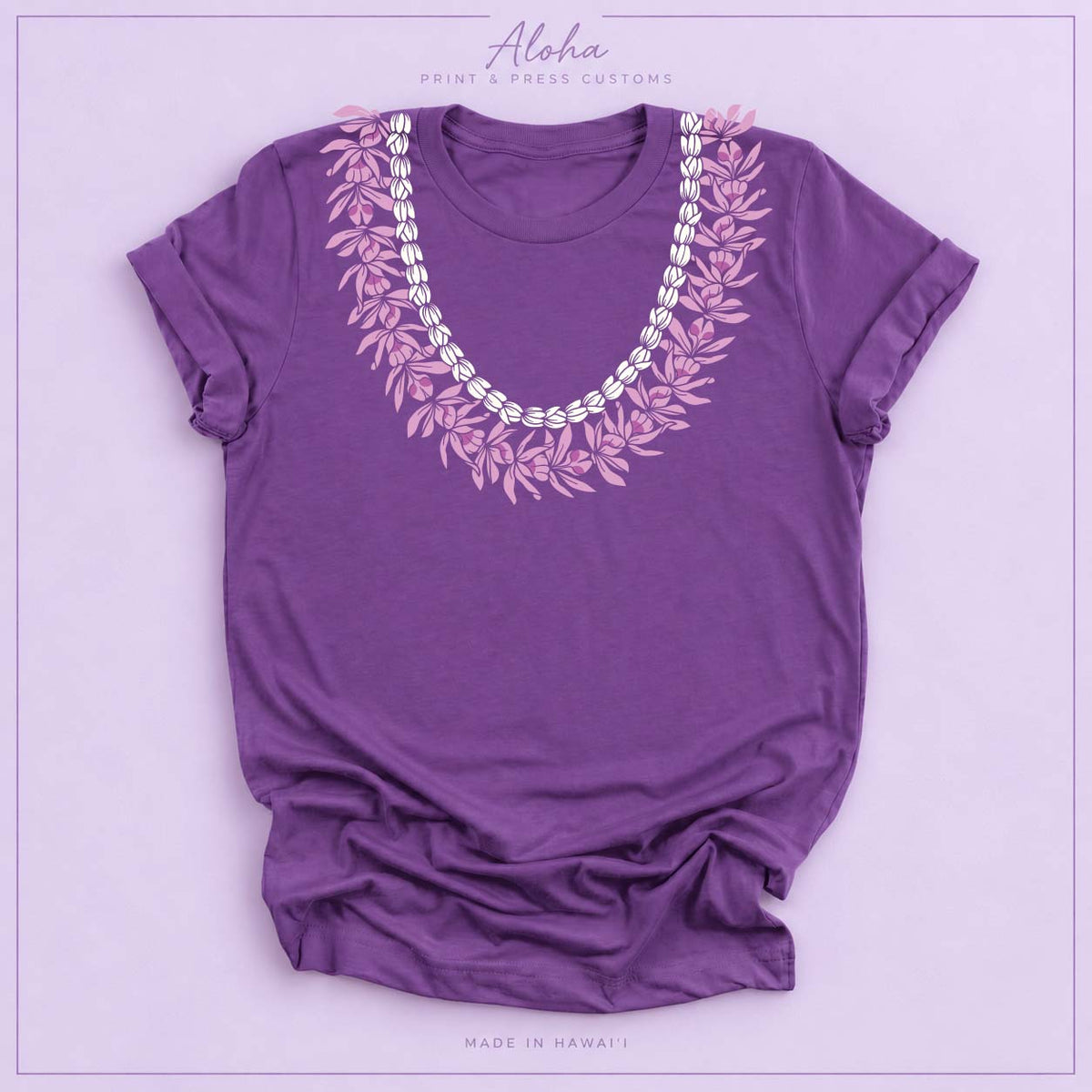 Purple T-shirt with Honohono and Pikake Hawaiian lei design on Aloha Print & Press Customs branded background
