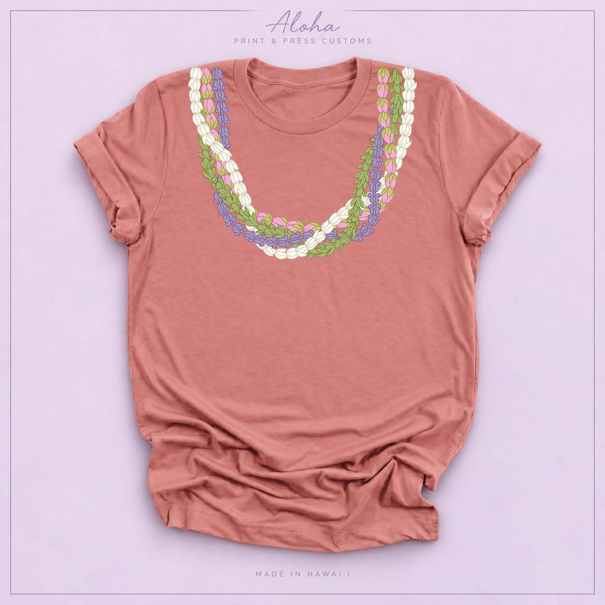 Mauve T-shirt featuring an island-inspired floral lei design on Aloha Print & Press Customs branded background