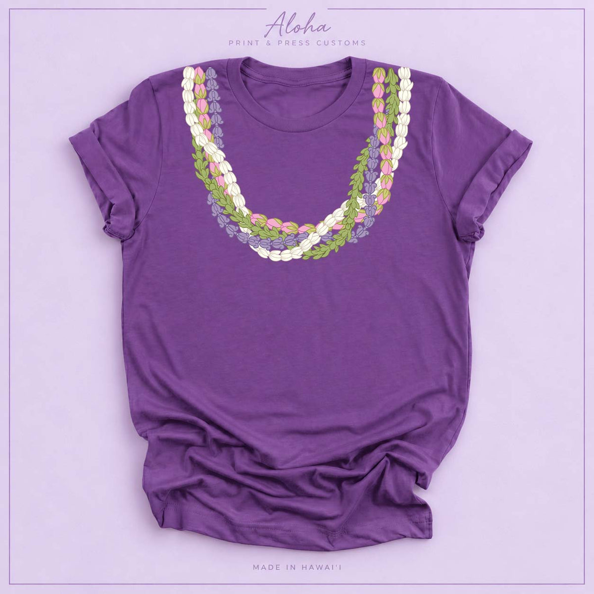 Purple T-shirt featuring an island-inspired floral lei design on Aloha Print & Press Customs branded background
