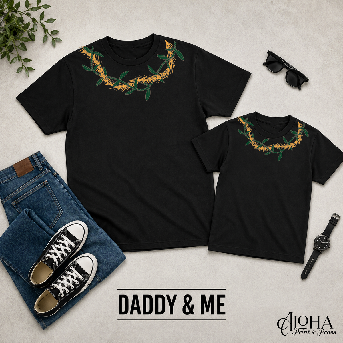 Kukunaokala and Ti Leaf Daddy and Me matching lei shirts in black