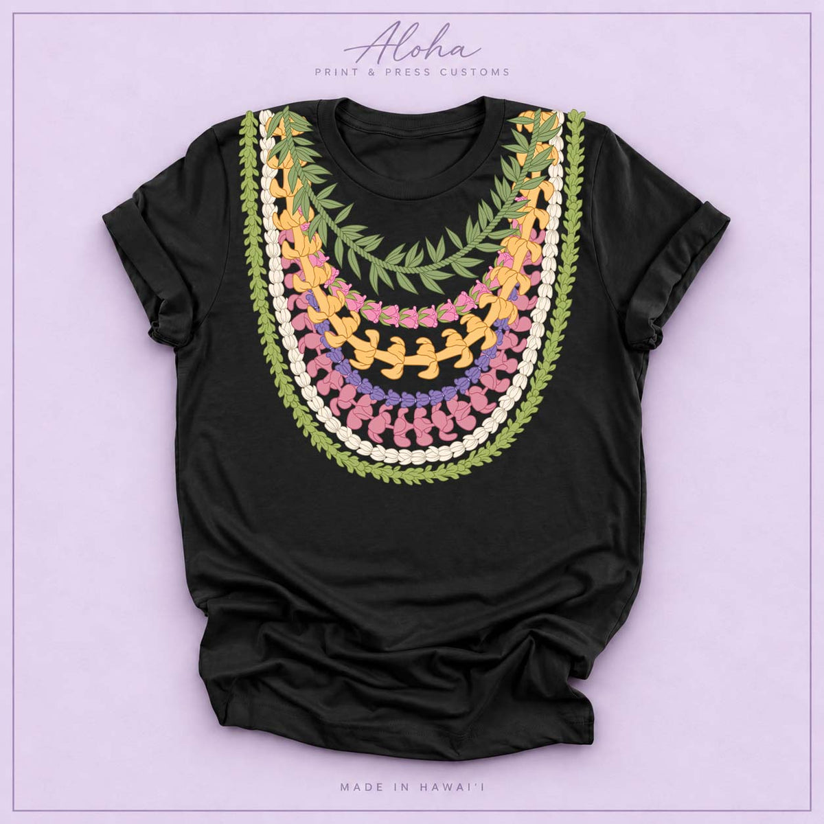 Black T-shirt featuring Maile, Pikake, Crownflower, and Puakenikeni lei design