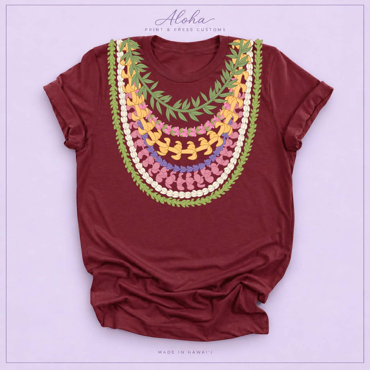 Maroon T-shirt featuring Maile, Pikake, Crownflower, and Puakenikeni lei design