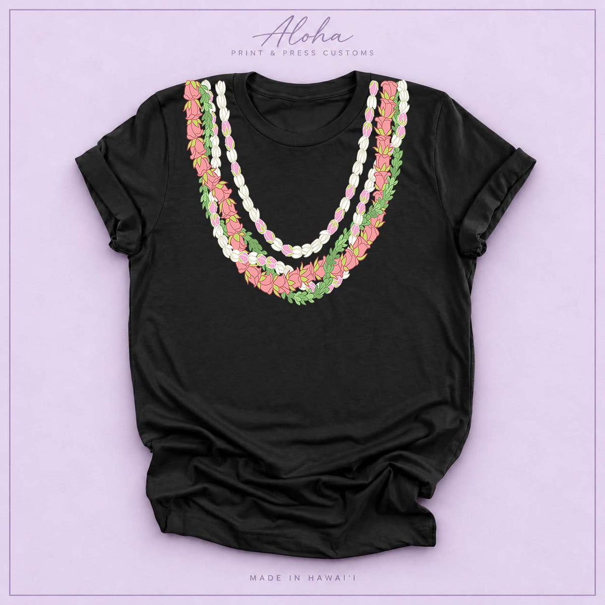 Black T-shirt with Lokelani, Pikake, and Pakalana Hawaiian lei design on Aloha Print & Press Customs branded background