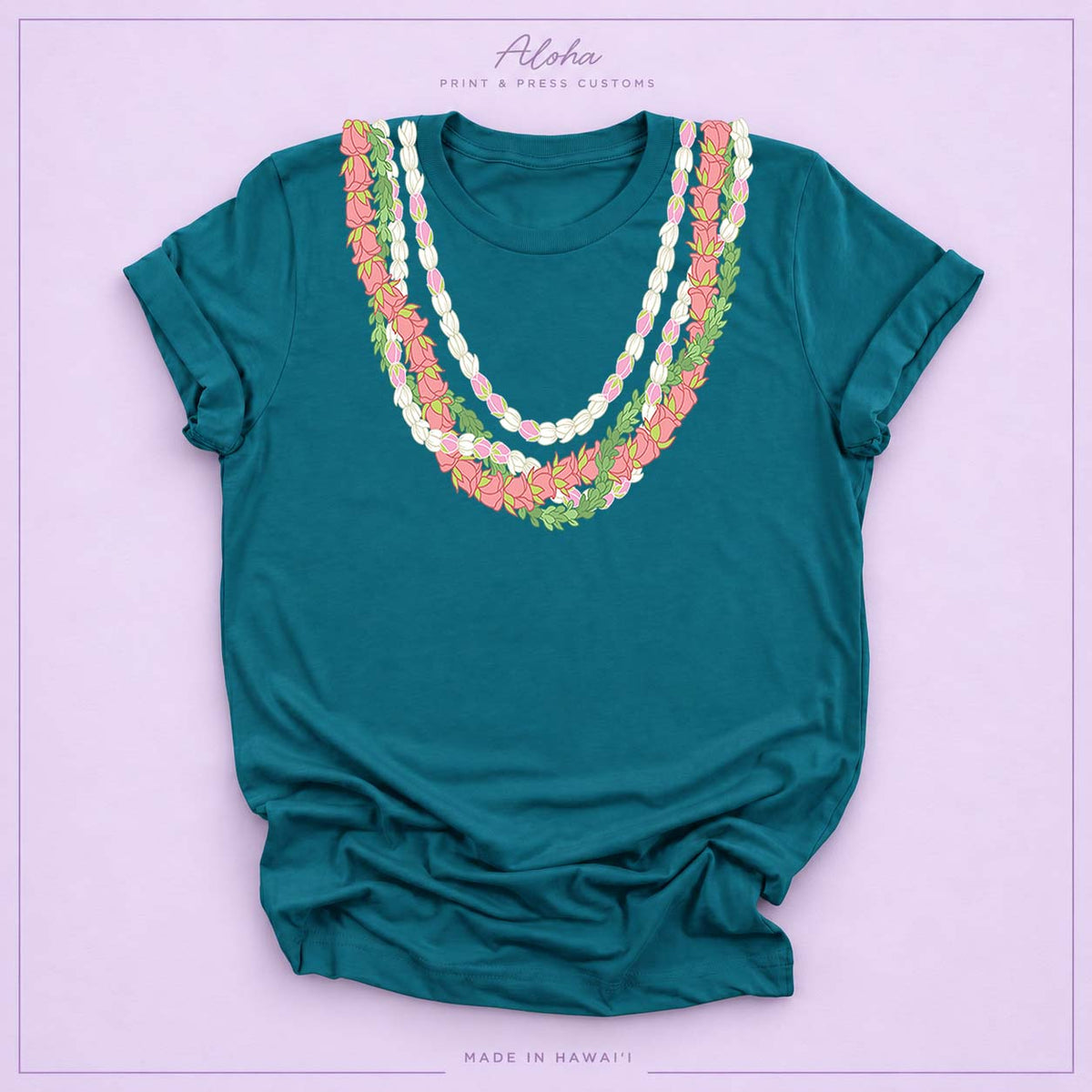 Deep teal T-shirt with Lokelani, Pikake, and Pakalana Hawaiian lei design on Aloha Print & Press Customs branded background