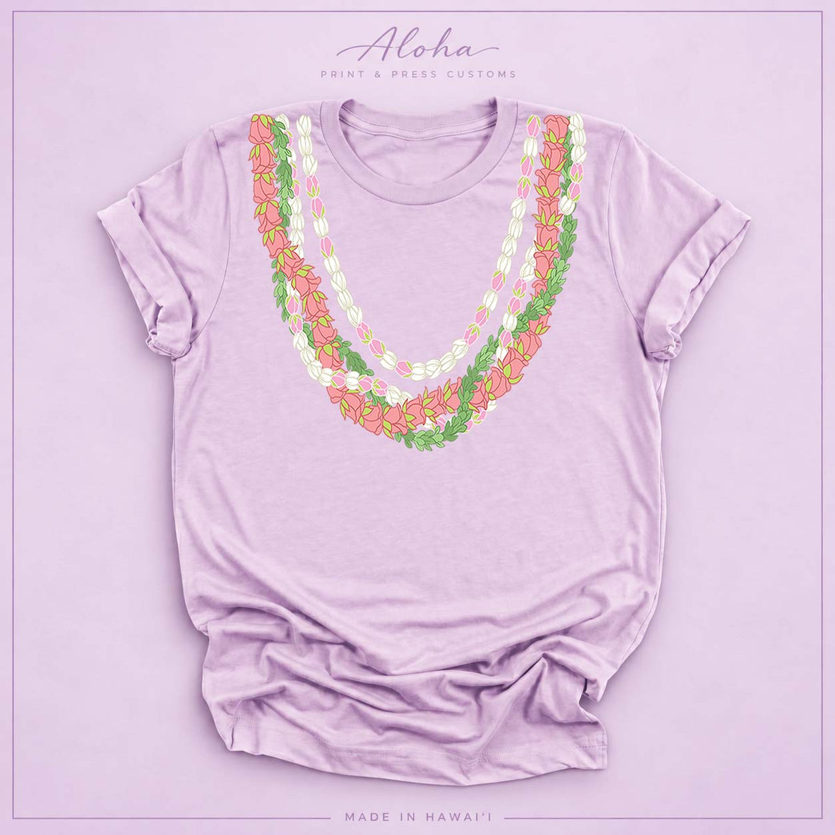 Lilac T-shirt with Lokelani, Pikake, and Pakalana Hawaiian lei design on Aloha Print & Press Customs branded background