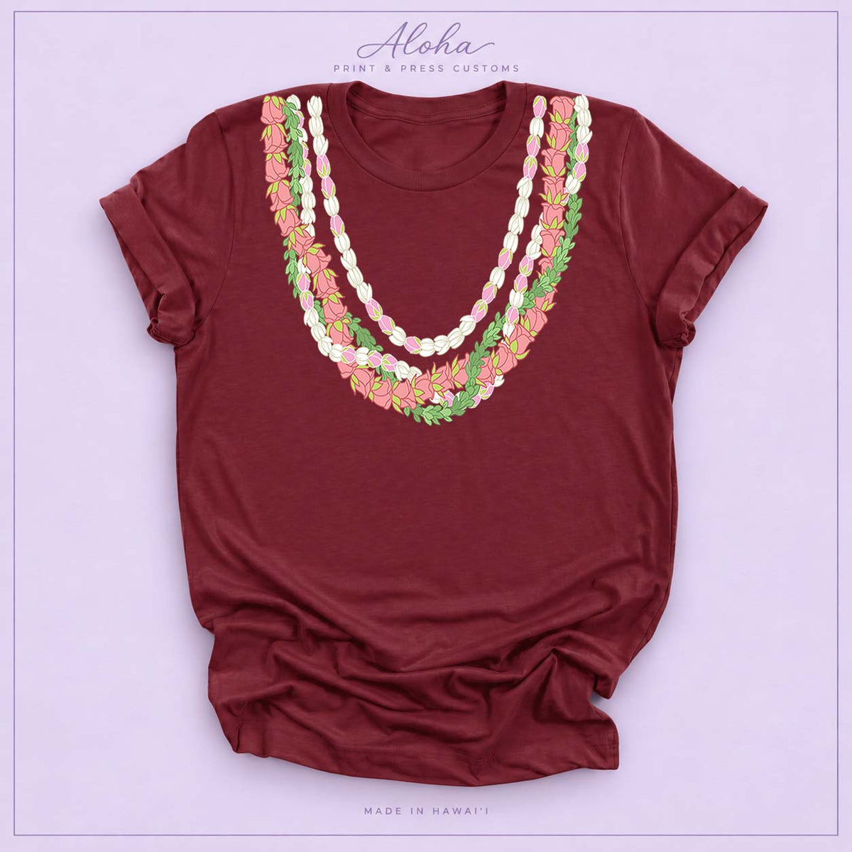 Maroon T-shirt with Lokelani, Pikake, and Pakalana Hawaiian lei design on Aloha Print & Press Customs branded background