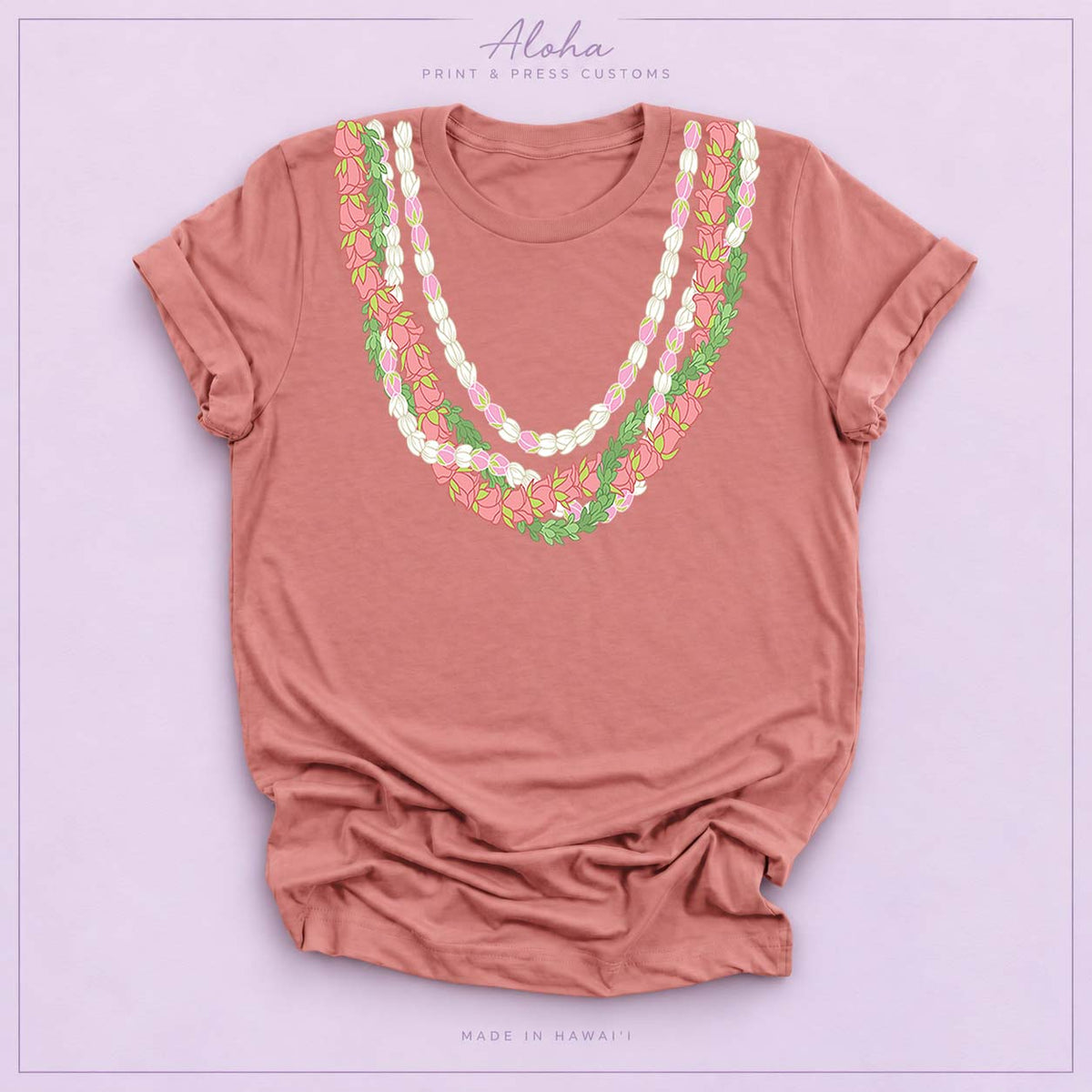 Mauve T-shirt with Lokelani, Pikake, and Pakalana Hawaiian lei design on Aloha Print & Press Customs branded background