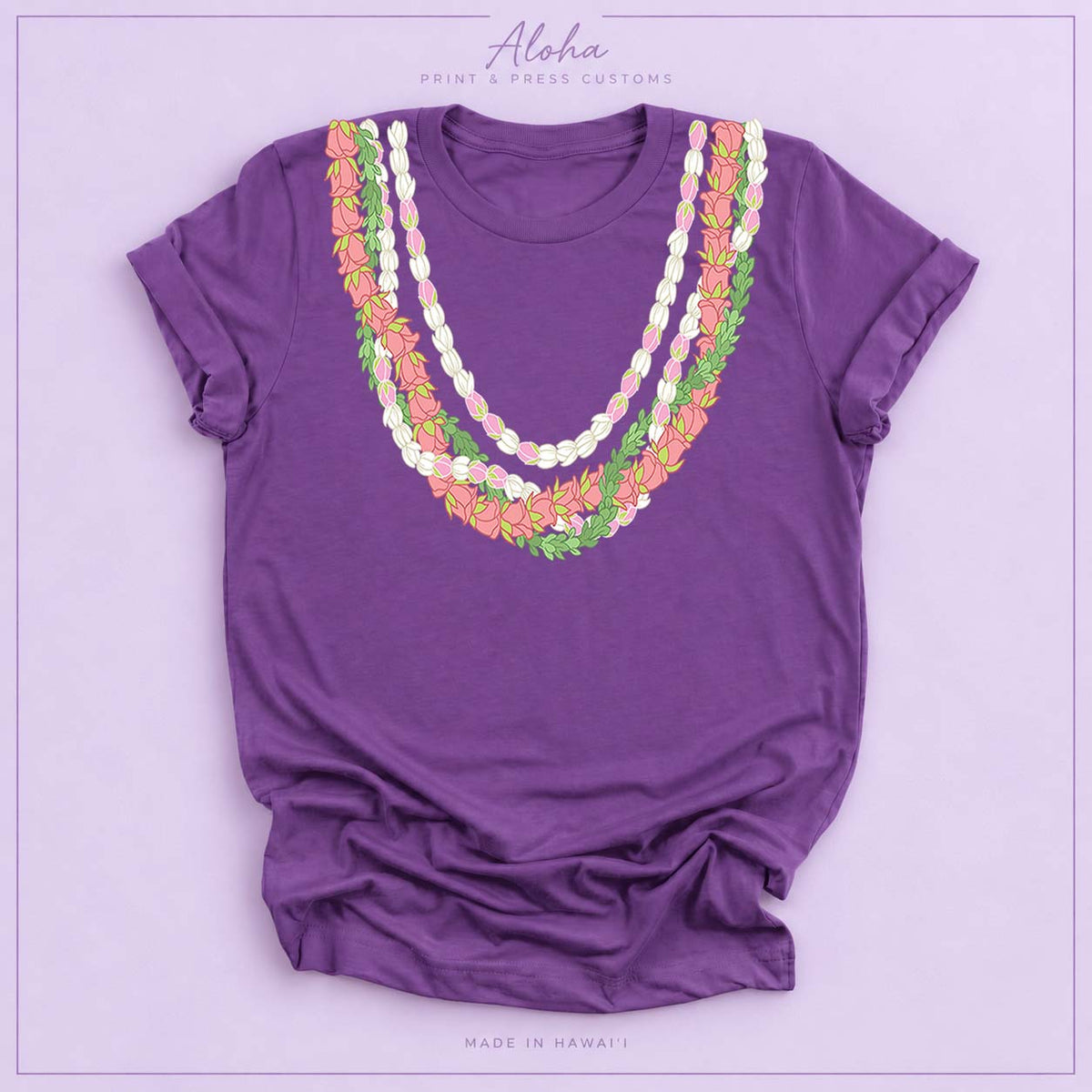 Royal purple T-shirt with Lokelani, Pikake, and Pakalana Hawaiian lei design on Aloha Print & Press Customs branded background