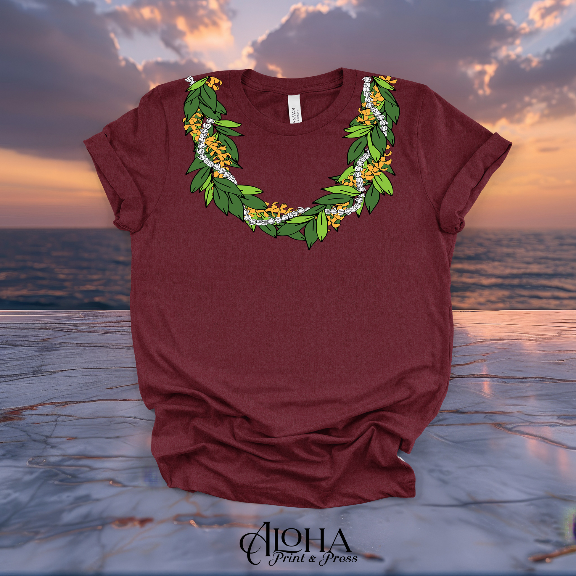 Maroon Hawaiian lei T-shirt featuring maile leaves, golden puakenikeni flowers and white pikake blossoms