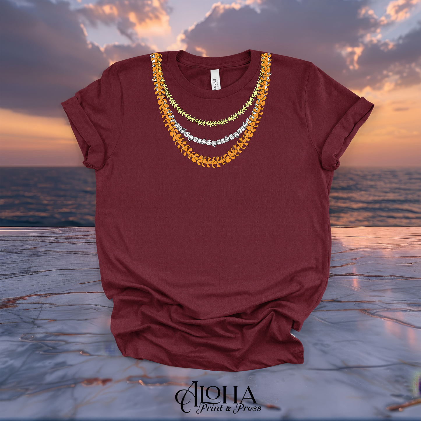 Maroon red t-shirt with layered Hawaiian lei flowers printed around the neckline.