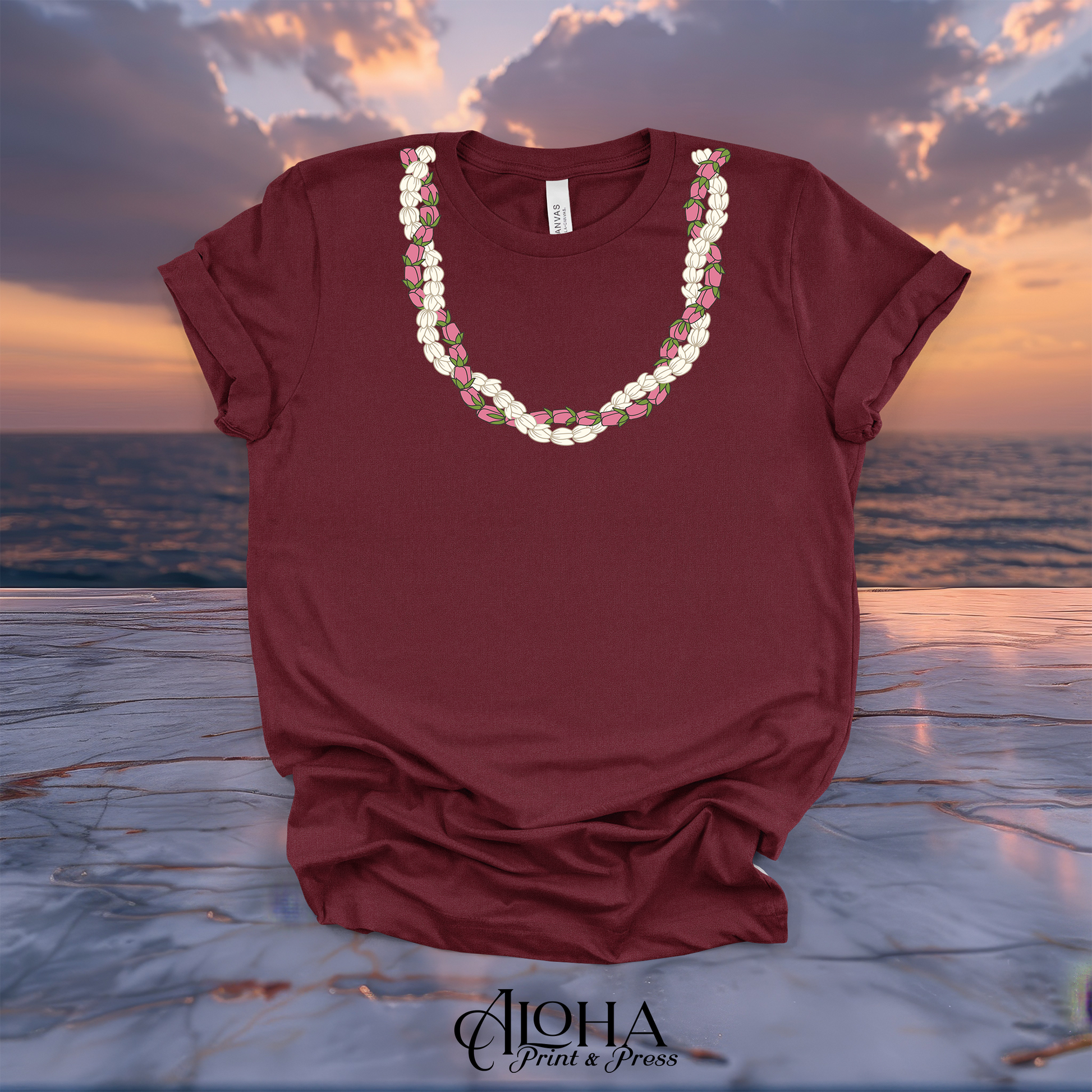 Maroon dark red custom printed crewneck tee showing a detailed Hawaiian style Pikake and Lokelani rose flower lei graphic