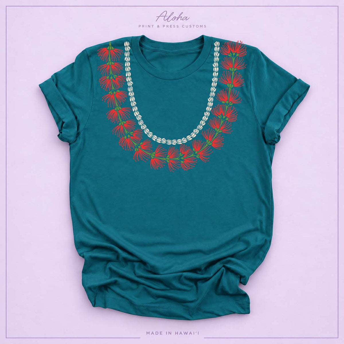 Deep teal T-shirt featuring a ʻŌhiʻa Lehua and pikake lei design