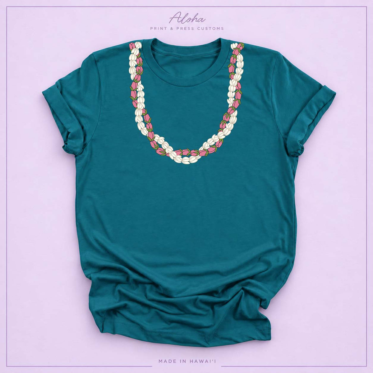 Deep teal T-shirt featuring a Pikake and Lokelani lei design on Aloha Print & Press Customs branded background