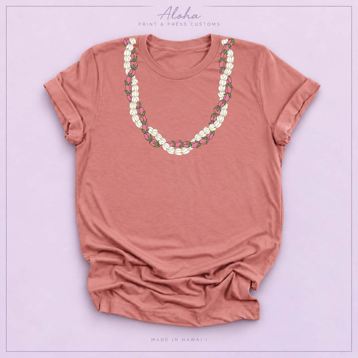 Mauve T-shirt featuring a Pikake and Lokelani lei design on Aloha Print & Press Customs branded background