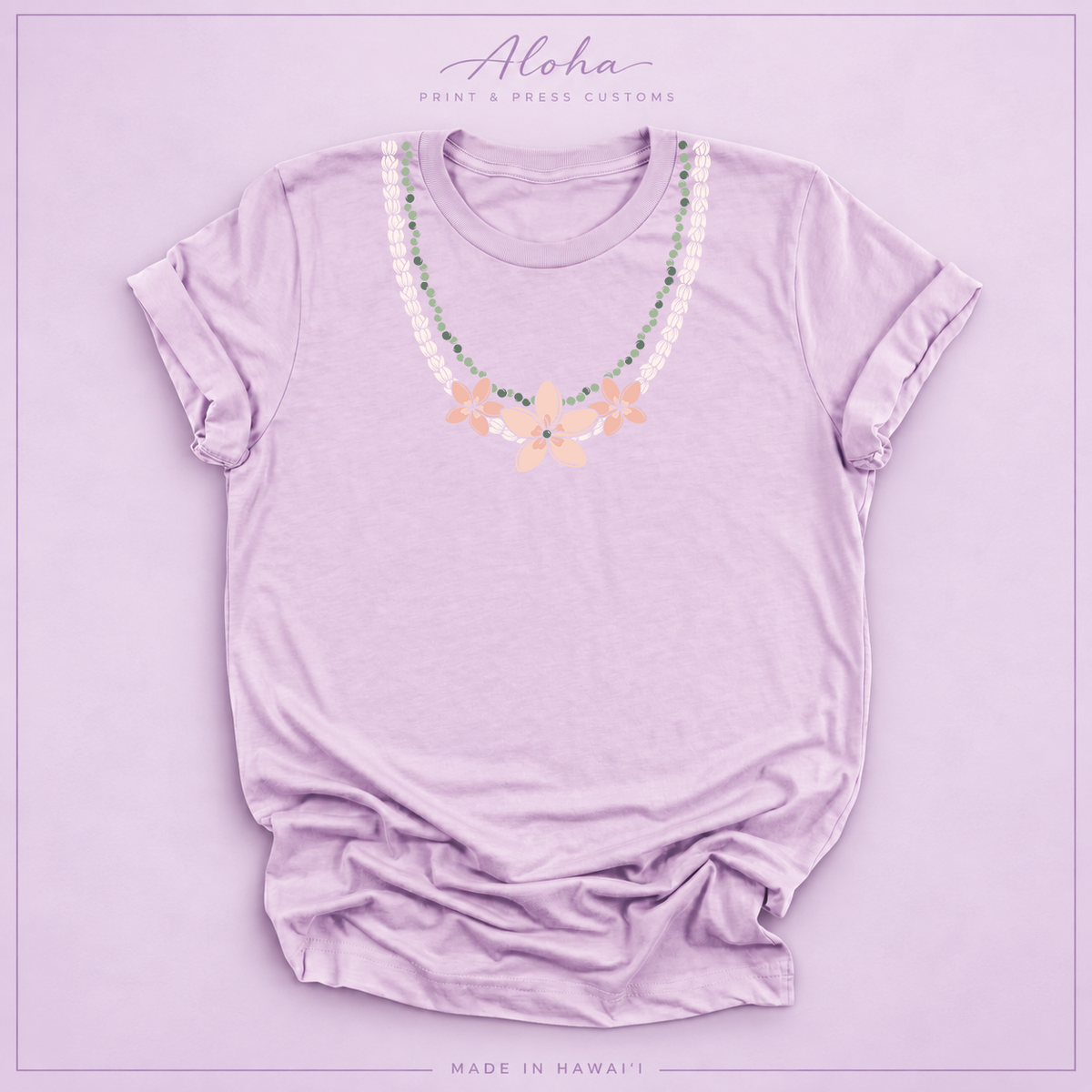 Lilac T-shirt with Pikake Mokihana Plumeria Hawaiian lei necklace design on Aloha Print & Press Customs branded background