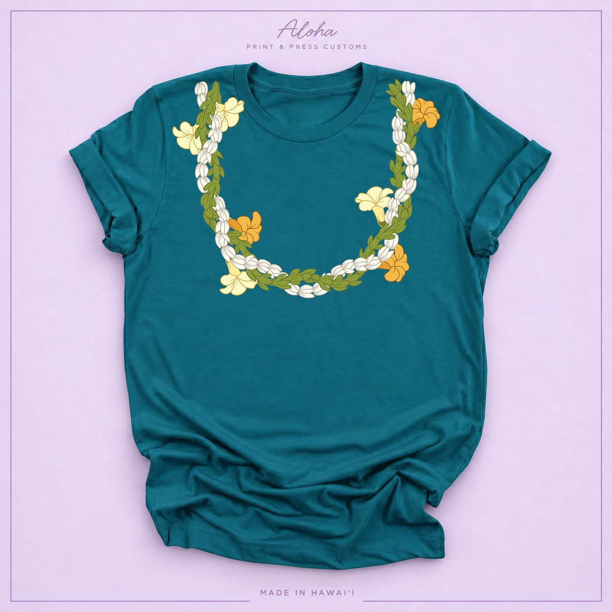 Deep teal T-shirt with Pikake, Pakalana, and Puakenikeni lei design on Aloha Print & Press Customs branded background