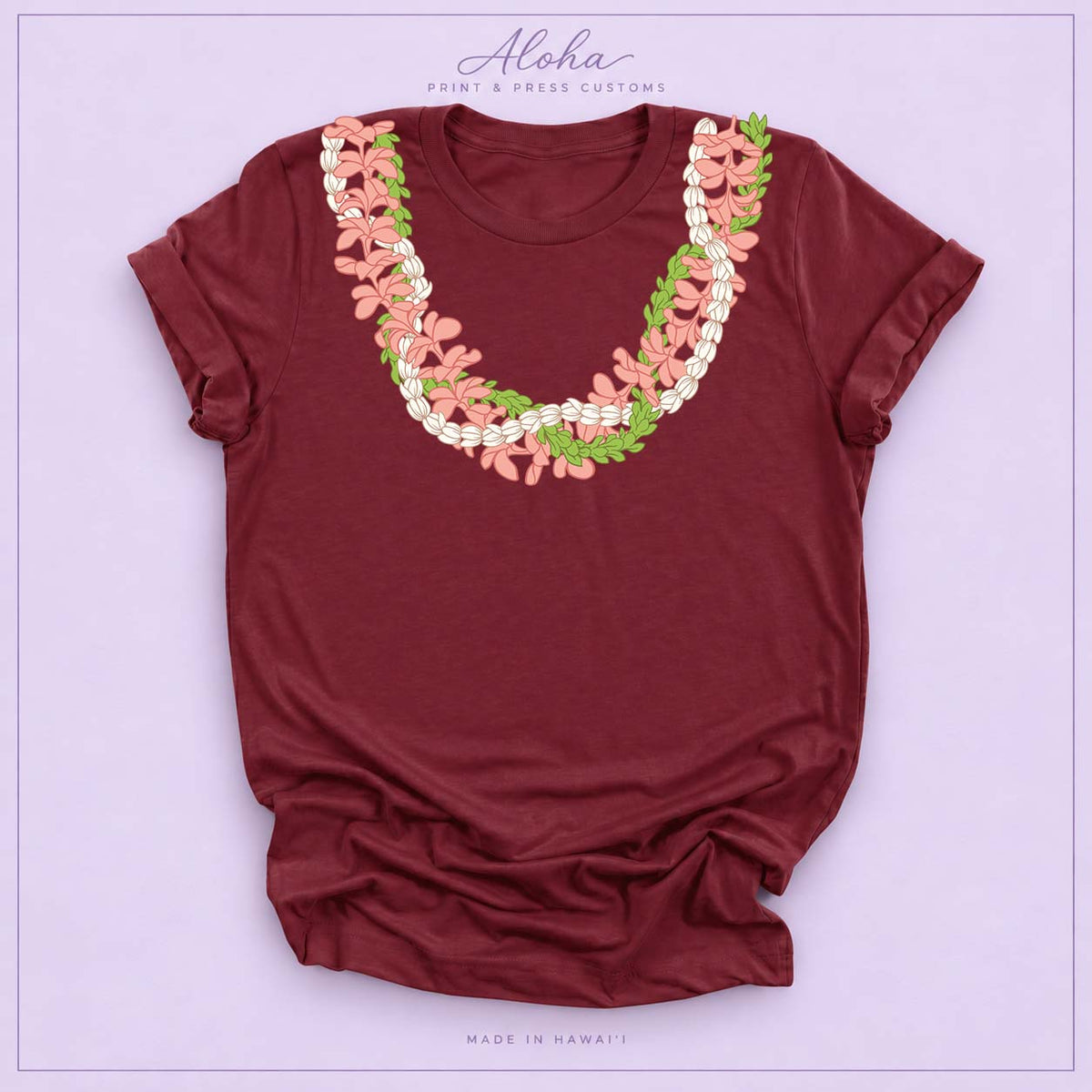 Maroon T-shirt featuring a Plumeria and Pikake lei design