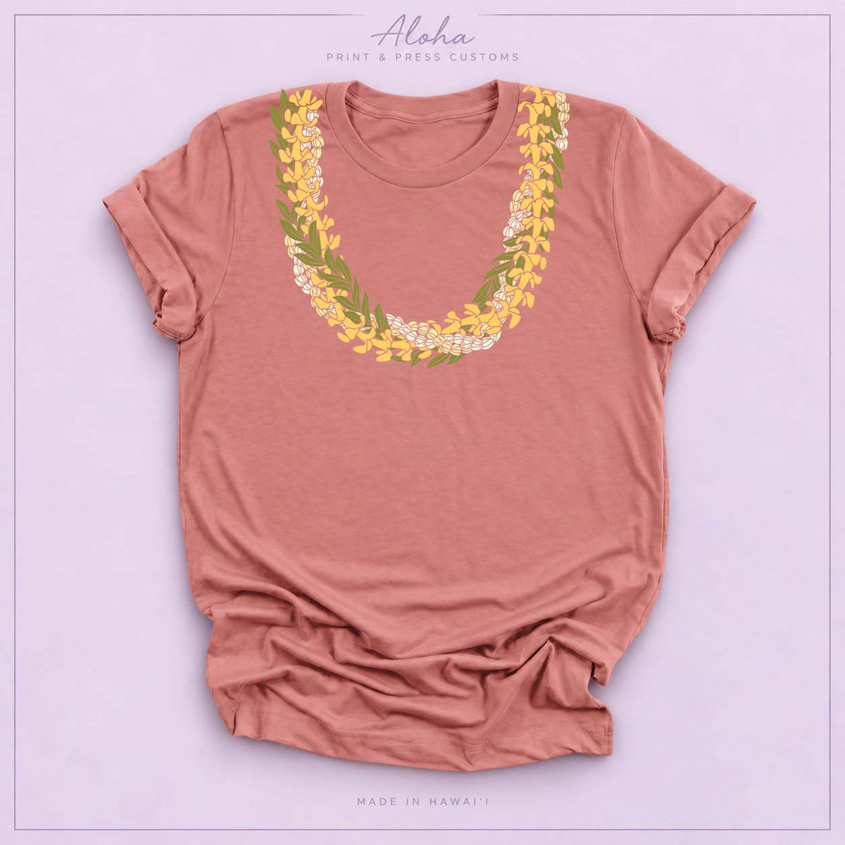 Mauve T-shirt with Puakenikeni, Maile, and Double Pikake lei design on Aloha Print & Press Customs branded background