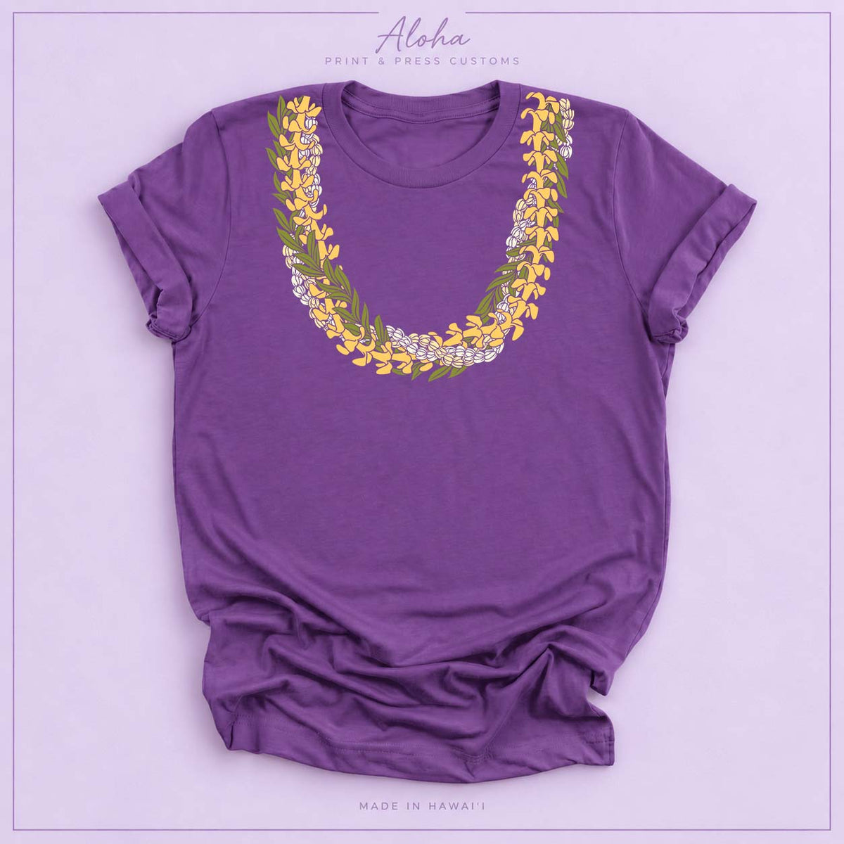 Purple T-shirt with Puakenikeni, Maile, and Double Pikake lei design on Aloha Print & Press Customs branded background