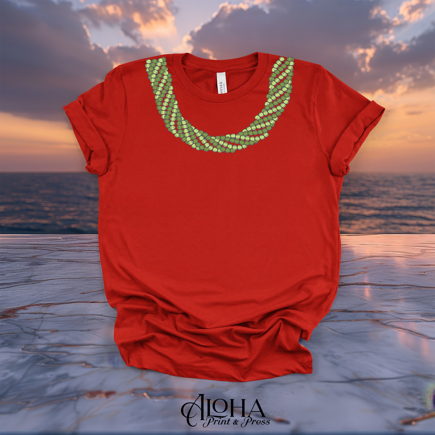 Red Mokihana lei T-shirt with a vibrant green Hawaiian lei neckline graphic and ocean sunset background