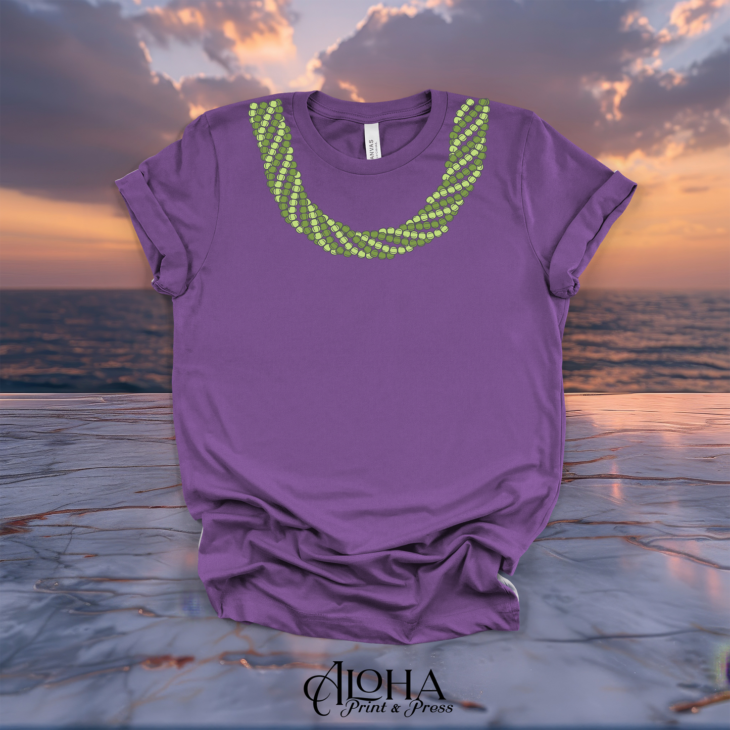 Royal purple Mokihana lei graphic T-shirt featuring a green layered lei neckline design