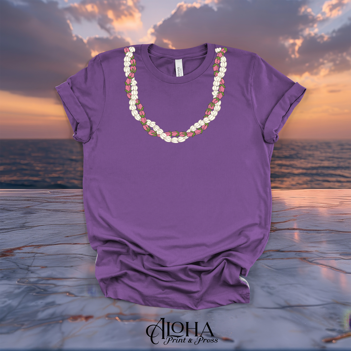Royal purple short sleeve graphic tee featuring a local custom Pikake and Lokelani rose lei pattern by Aloha Print and Press