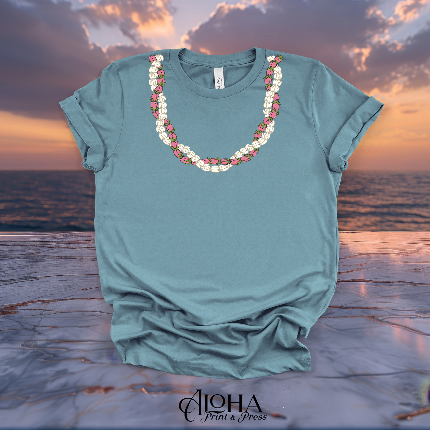 Vintage Denim steel blue premium cotton t shirt decorated with a traditional island style Pikake and Lokelani flower lei